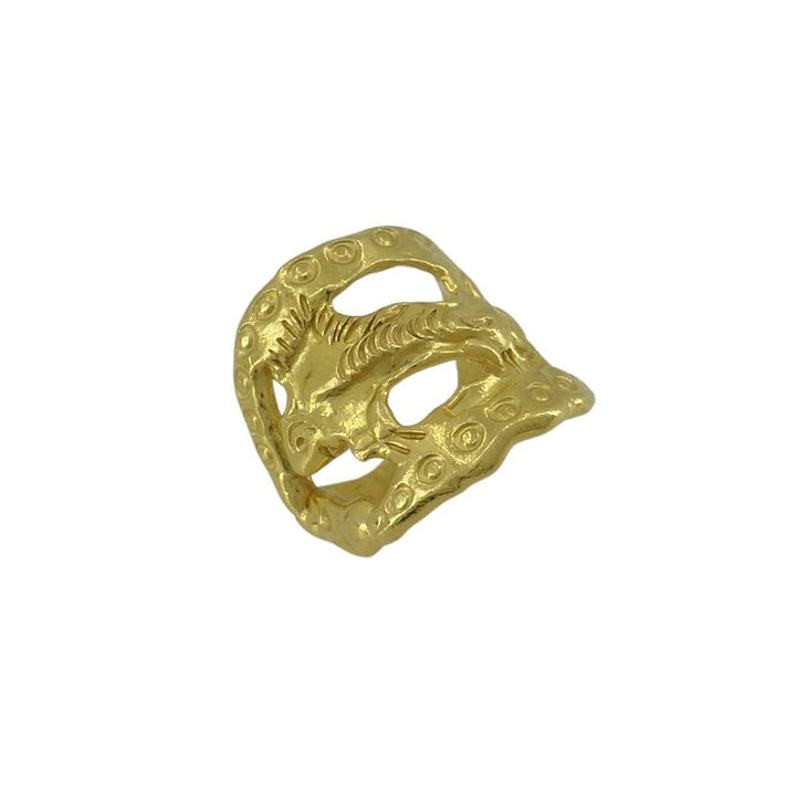 A vintage gold-colored ring with a fish motif design, part of the Jean Mahie darling monsters collection.