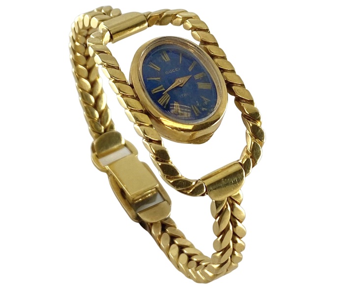 Gucci - A lady's gold plated bangle watch, circa 1994 - model 11/12.2, the  signed circular white in - Cheffins Fine Art